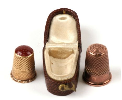 A Charles Horner 9ct gold thimble; together with another in a leather case with carnelian top.Condition ReportCharles Horner 
