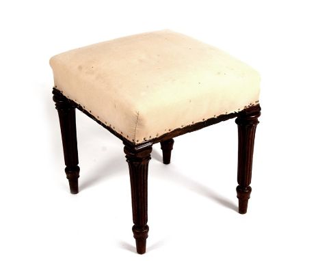 A 19th century mahogany stool on turned legs with upholstered seat.