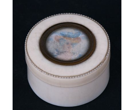 A 19th century ivory powder pot set with a watercolour portrait miniature of a young woman. 5cm ( 2 ins) diameter