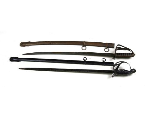 A late 19th century cavalry sword of small proportions in its brass scabbard, with the initial "M" to the knuckleguard, blade