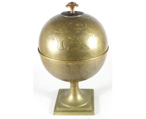 A brass terrestrial globe caddy 32cm (12.5 ins) high.