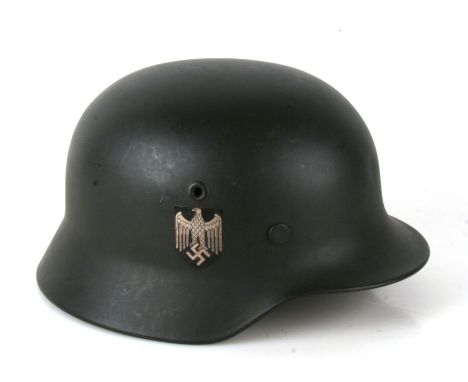 From a private collection, a Third Reich M40 helmet with liner and chin strap, double decals Freies Indien and Army. Producti