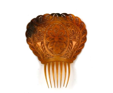 A large 19th century tortoiseshell mantilla comb, decorated with two cornucopia and numerous flowers all over. 19cm (7.5 inch