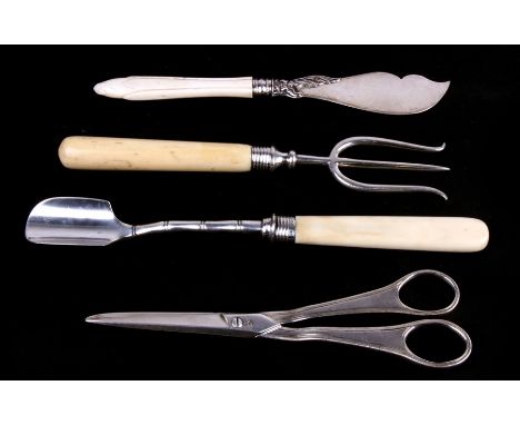 A pair of Georgian silver scissors, and ornate butter spreader, a stilton cheese shovel, and a three prong gammon meat fork.