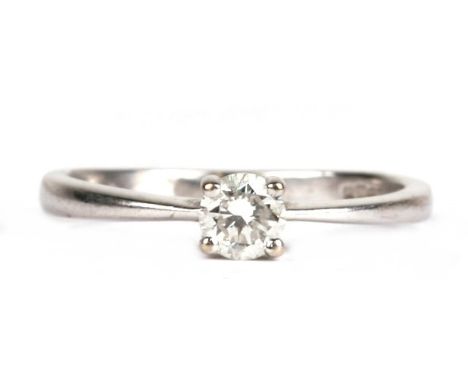 A 9ct white gold diamond solitaire ring, approx UK size 'K'.