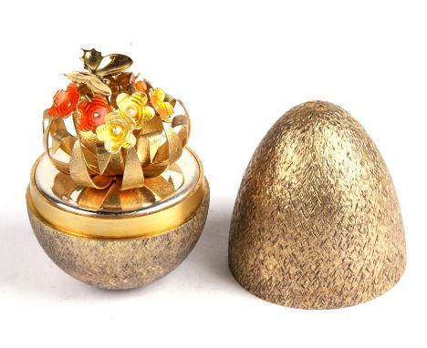 A Stuart Devlin silver and enamel surprise egg, opening to reveal a butterfly upon flowers, London 1981, numbered 55 in origi