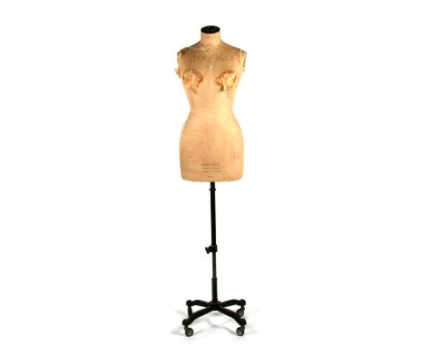 A Stockman dressmaker's mannequin dummy, No. 50406, on an associated Lindsell cast iron stand.