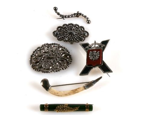 A Scottish hardstone set brooch; together with a 9ct gold mounted jade bar brooch; and other items.
