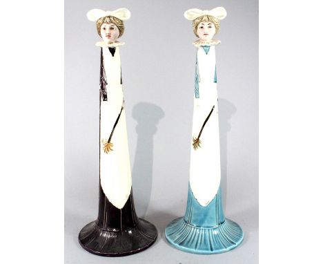 A pair of secessionist Art Nouveau tubelined candlesticks in the form of housemaids, possibly Minton. Ex Christies, labels to