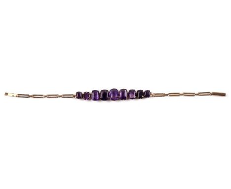 A 9ct gold (unmarked but tested) and graduated amethyst bracelet, 5.4g. 16cm (6.25 ins) long, 5.4g.