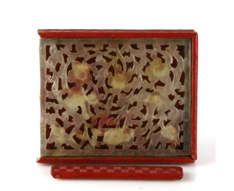 A Chinese cinnabar lacquer rectangular box with inset pierced jade panel to the top, 12.5cms (5ins) wide. (a/f)