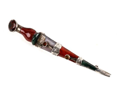 A large Scottish specimen agate and silver cloak pin in the form of a dagger, 10cms (4ins) long.
