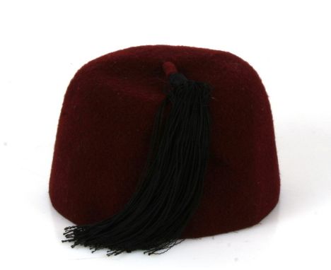 From a private collection, a Waffen SS Handschar Division maroon felt fez. Missing its cloth badges. Buyers are strictly remi