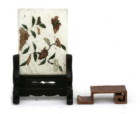 A Chinese jade panel on a hardwood stand, decorated with a butterfly and flowers with applied hard stones, 8 by 11cms (3.1 by