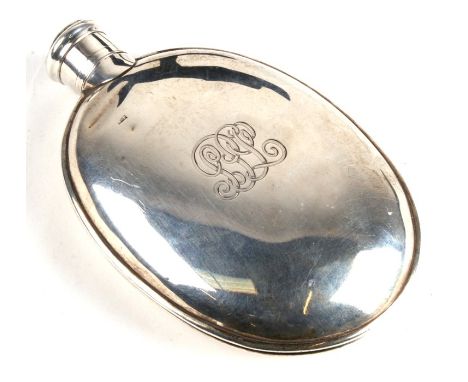 An oval silver hip flask, initialled, with indistinct London hallmark. 128g. 12.5cm (5 ins) high