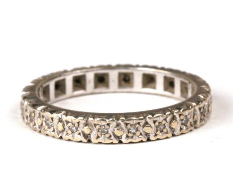 A 9ct white gold diamond set eternity ring, approx UK size 'K'.