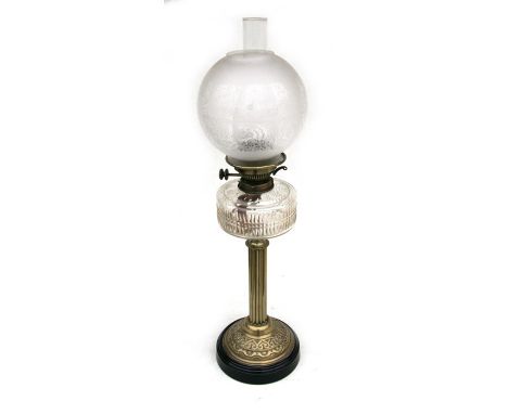 A Victorian oil lamp with etched glass shade and cut glass reservoir, on a brass Corinthian column, 66cms (26ins) high.