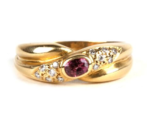 An 18ct gold, ruby &amp; diamond multistone crossover ring, 4.3g. Approx. UK size O. 