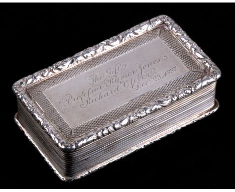 A large rectangular silver snuff box with reeded decoration and raised floral banding all round. Joseph Wilmore, 106g. Birmin