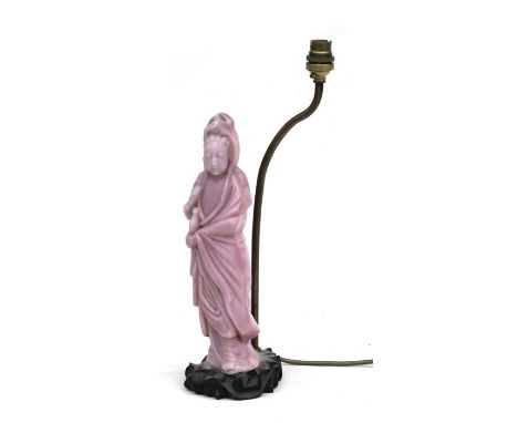 A Chinese pink Peking glass figural table lamp in the form of Guanyin, 33cms (13ins) high.