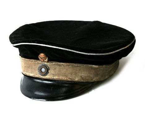 From a private collection, a WWI German Seebatallion black felt cap with wire support inside. White piping &amp; band and a W