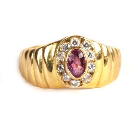 An 18ct gold, amethyst and diamond cluster ring, 3.2g. Approx. UK size J. 
