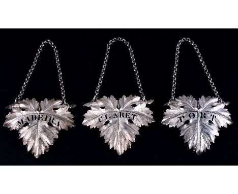 A set of three large vine leaf decanter or wine labels: MADEIRA, CLARET, AND PORT. London 1829 and 1828. Maker William Ker Re