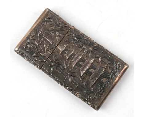 A Chinese silver card case with all over embossed decoration depicting figures in a garden and a pagoda, makers mark for Wang