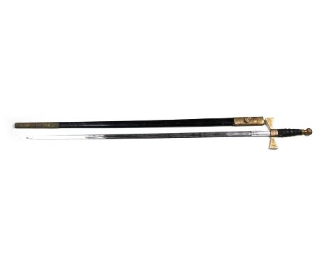 An early 20th century Masonic named presentation sword in its steel scabbard with brass mounts. Having a finely etched blade 