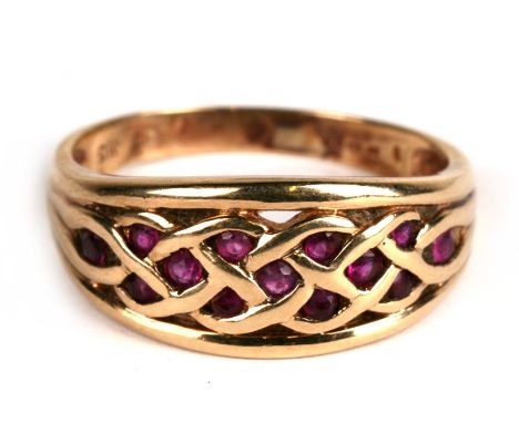 A 9ct gold ruby set Celtic design ring, approx UK size 'T'.