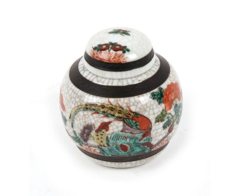 A Chinese crackle glaze ginger jar, decorated a bird and flowers, red seal mark to the underside. 11cm (4.25 ins) high