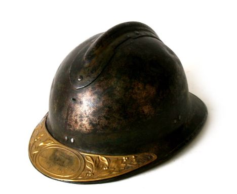 From a private collection, a WW2 French Adrian helmet, no liner, with brass plaque attached to the visor which indicates that