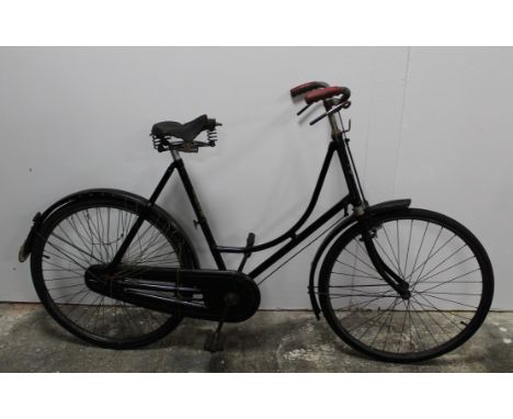 An early 20th century Matchless black enamel and gilt lined ladies bicycle, with roller lever brakes and chain guard, frame n