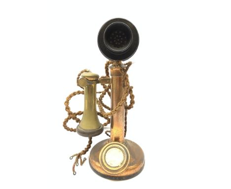 An early 20th century brass stick telephone, with Bakelite mouth and ear piece, H31cm.  Condition Report Click here for furth