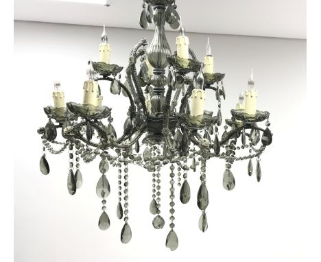 Large twelve light glass chandelier, baluster shaped central glass column supporting four short arms above a second tier of e