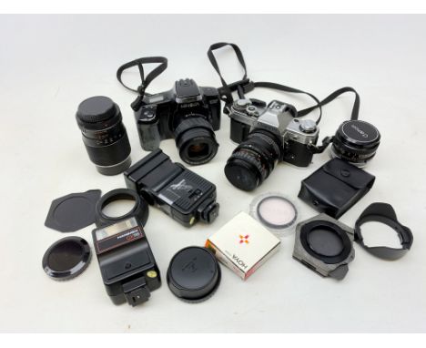 A Canon AE-1 camera, plus a Minolta Dynax 5000i camera, together with a selection of accessories, comprising various lenses, 