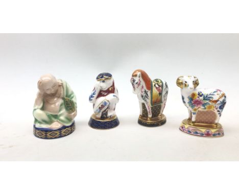 A group of four Royal Worcester candle snuffers from The Connoisseur Collection, comprising Sleeping Buddha, Chinese year of 