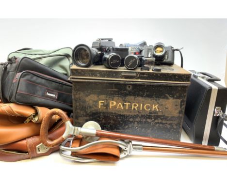 Two Vintage shooting sticks, one with leather seat, together with a Asahi Pentax Spotmatic camera, a number of assorted camer