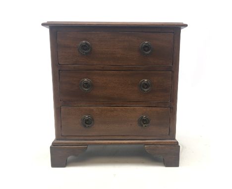 A 19th century mahogany miniature or apprentice chest of drawers, with three long drawers and raised upon bracket feet, H29.5