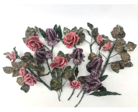 A small collection of ceramic flowers, in the form of pink roses and purple buds, with painted tin leaves.  Condition Report 