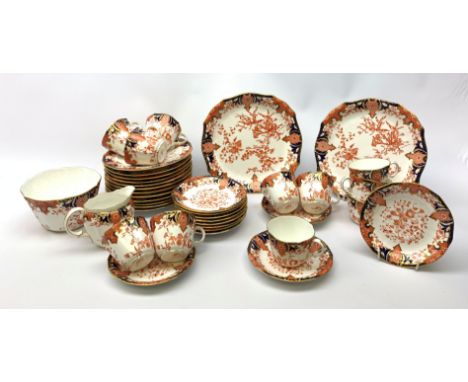 A Crown Derby Imari 2712 pattern part tea service, comprising eleven teacups, twelve saucers, twelve side plates, two serving