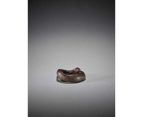   A WOOD NETSUKE OF A COILED SNAKE  Unsigned   Japan, 19th century to early 20th century    Finely carved with neatly incised