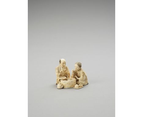   AN IVORY OKIMONO OF A COUPLE EATING  Japan, Meiji period (1868-1912)    Consisting of three separately carved parts attache