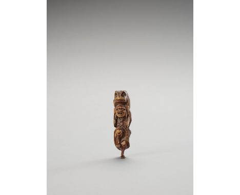   A TALL WOOD NETSUKE OF GAMA SENNIN WITH A LARGE TOAD  Unsigned  Japan, Meiji period (1868-1912)    The immortal with gilt e