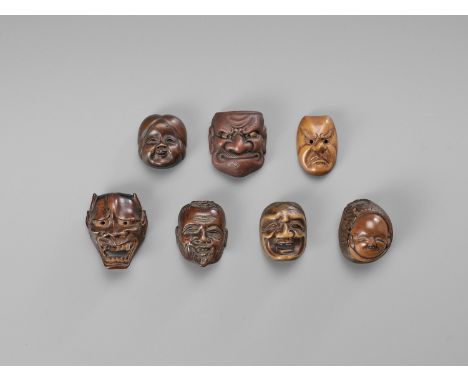   A GROUP OF SEVEN MASK NETSUKE  Japan, 19th to 20th century    Of various depictions, consisting of five wood, one Onko ware