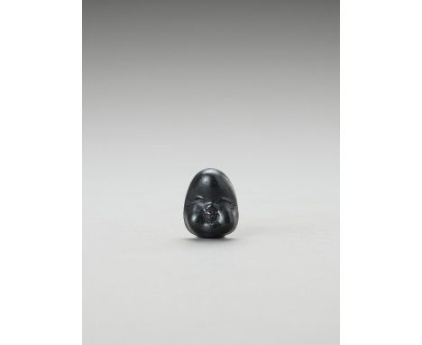   AN EBONY WOOD SHUNGA MASK NETSUKE OF OKAME  Unsigned  Japan, 19th century, Edo period (1615-1868)    The mask netsuke finel
