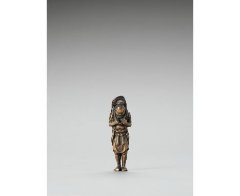   A WOOD NETSUKE OF A NIO GUARDIAN WITH LARGE WARAJI  Unsigned  Japan, Meiji period (1868-1912)    The temple guardian standi