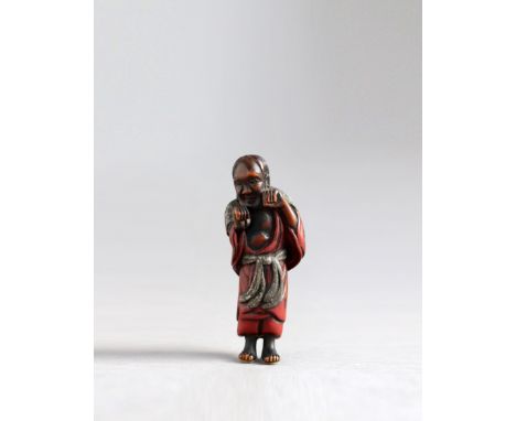  A LACQUERED WOOD NETSUKE OF A SAGE Unsigned Japan, 19th century, Edo period (1615-1868)  The wood netsuke lacquered in negor