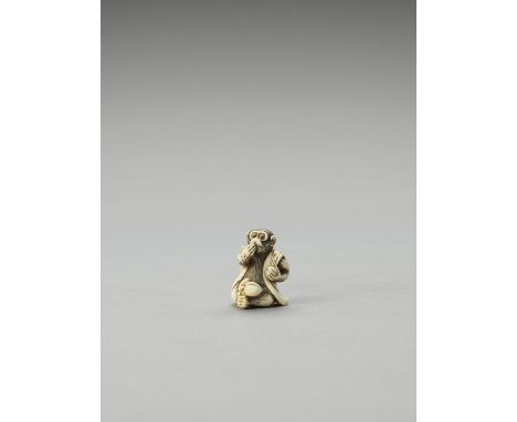   AN IVORY NETSUKE OF A MONKEY EATING FRUIT  Unsigned  Japan, 19th century    The monkey with finely incised fur and dark inl