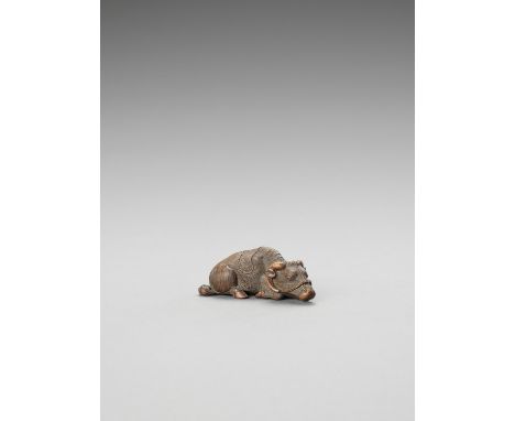   KIGYOKU: A WOOD NETSUKE OF A RECUMBENT OX  By Kigyoku, signed Kigyoku  Japan, 19th century    Finely carved as a recumbent 
